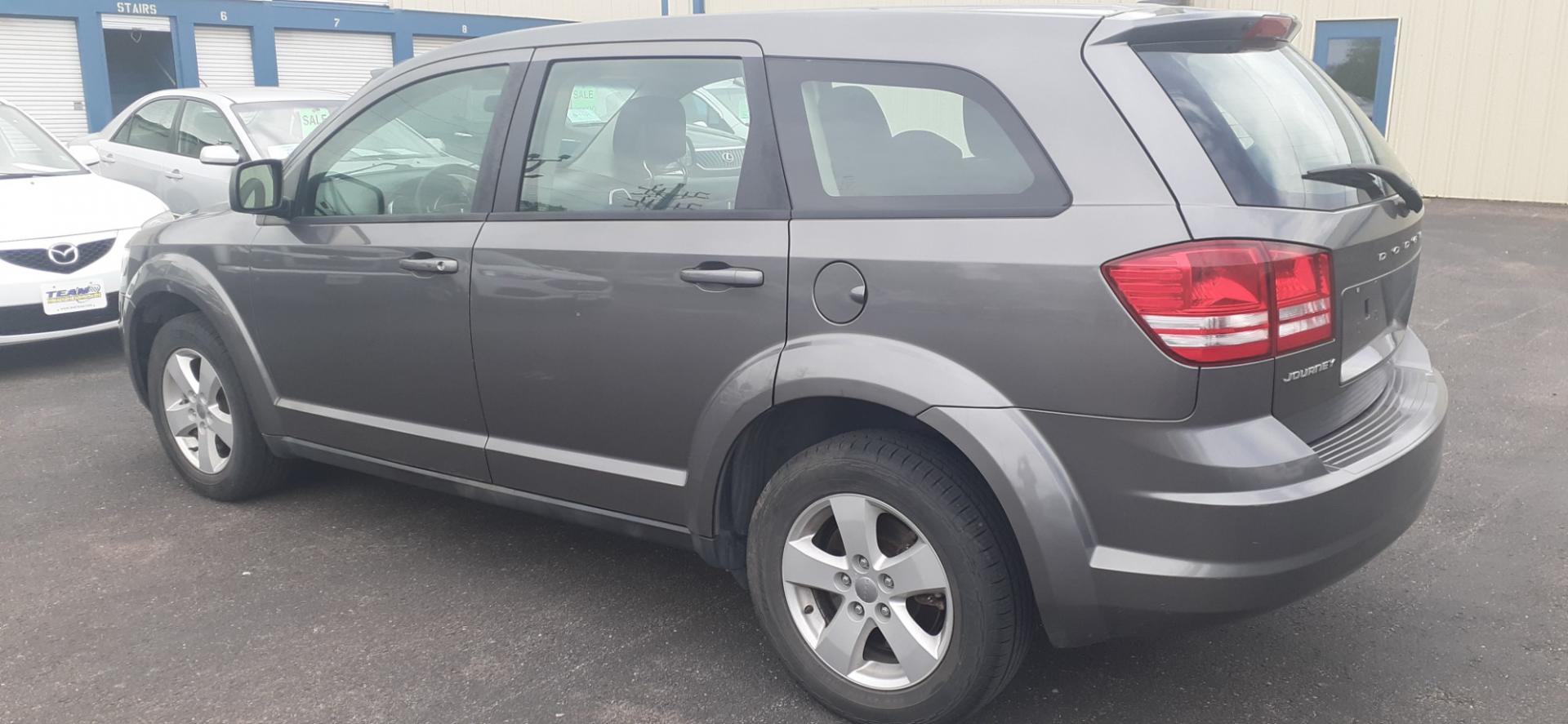 2013 Dodge Journey SE (3C4PDCAB0DT) with an 2.4L L4 DOHC 16V engine, 4-Speed Automatic transmission, located at 2015 Cambell Street, Rapid City, SD, 57701, (605) 342-8326, 44.066433, -103.191772 - CARFAX AVAILABLE - Photo#2